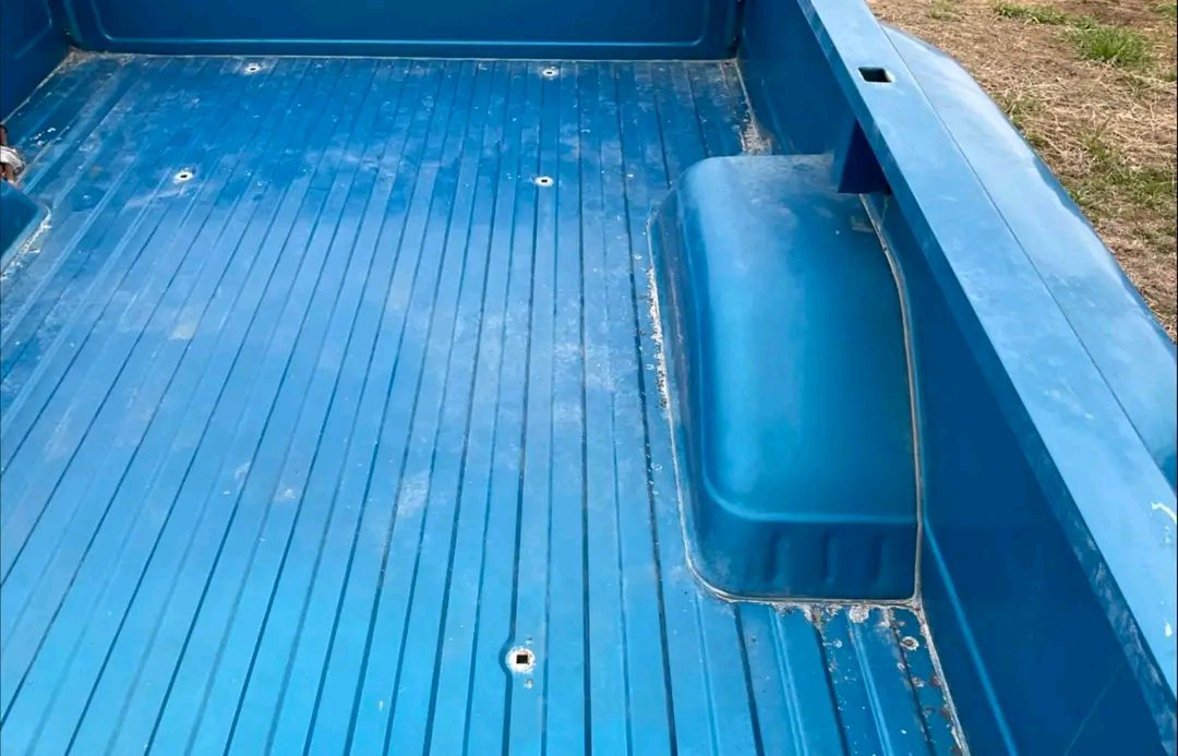 blue dually pickup truck bed from a third-generation Chevrolet C/K “Squarebody” truck (1973–1987).  it has no rust no dents