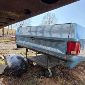 blue long-bed pickup truck bed that appears to be from a 1973–1987 Chevrolet or GMC "square body" truck.