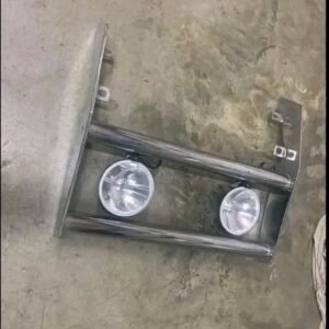 chrome roll bar and a matching push/grill guard with auxiliary off-road lights and light covers.
