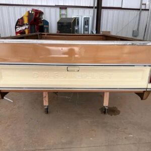 long-bed truck box from a 1973–1987 Chevrolet "squarebody" C/K pickup, featuring a two-tone beige and bronze-brown paint scheme.