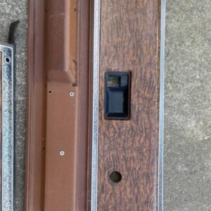brown interior door panel inserts and armrests with woodgrain trim, which appear to be original parts for 1973–1976 Chevrolet and GMC trucks, Suburbans, and SUVs.