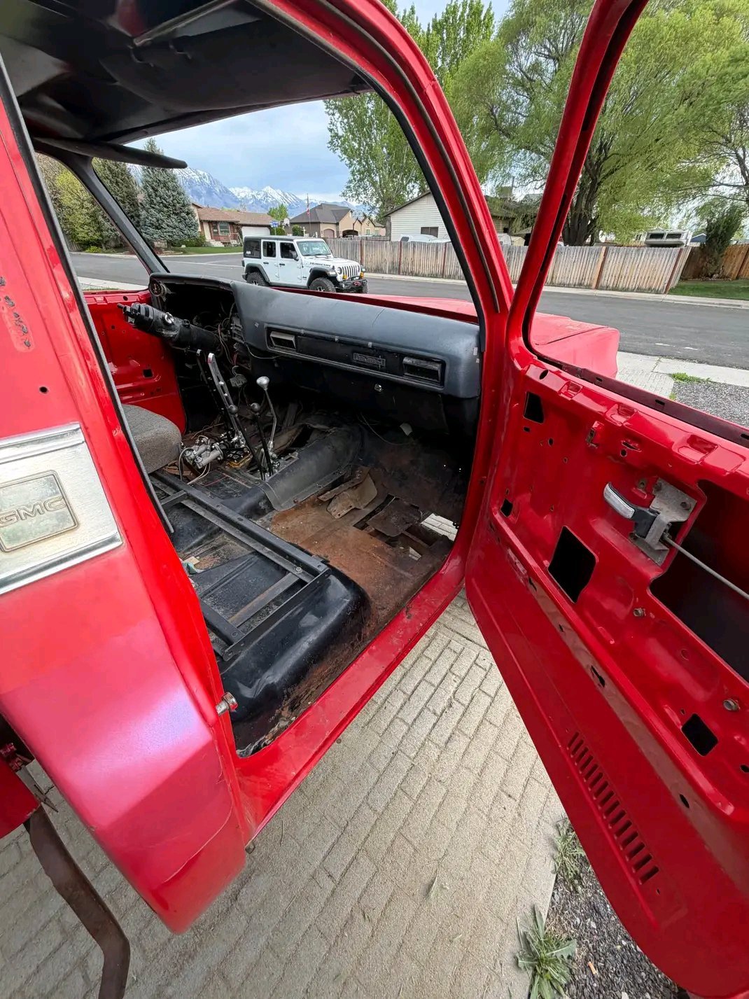 Vehicle Details

Generation: Built during the classic “squarebody” truck era (1973–1987).

Body Style: Features a distinctive stepside bed and an elevated 4×4 suspension stance.

Condition: Appears to be an active restoration or custom off-road build, with the windshield removed and the front clip partially disassembled.